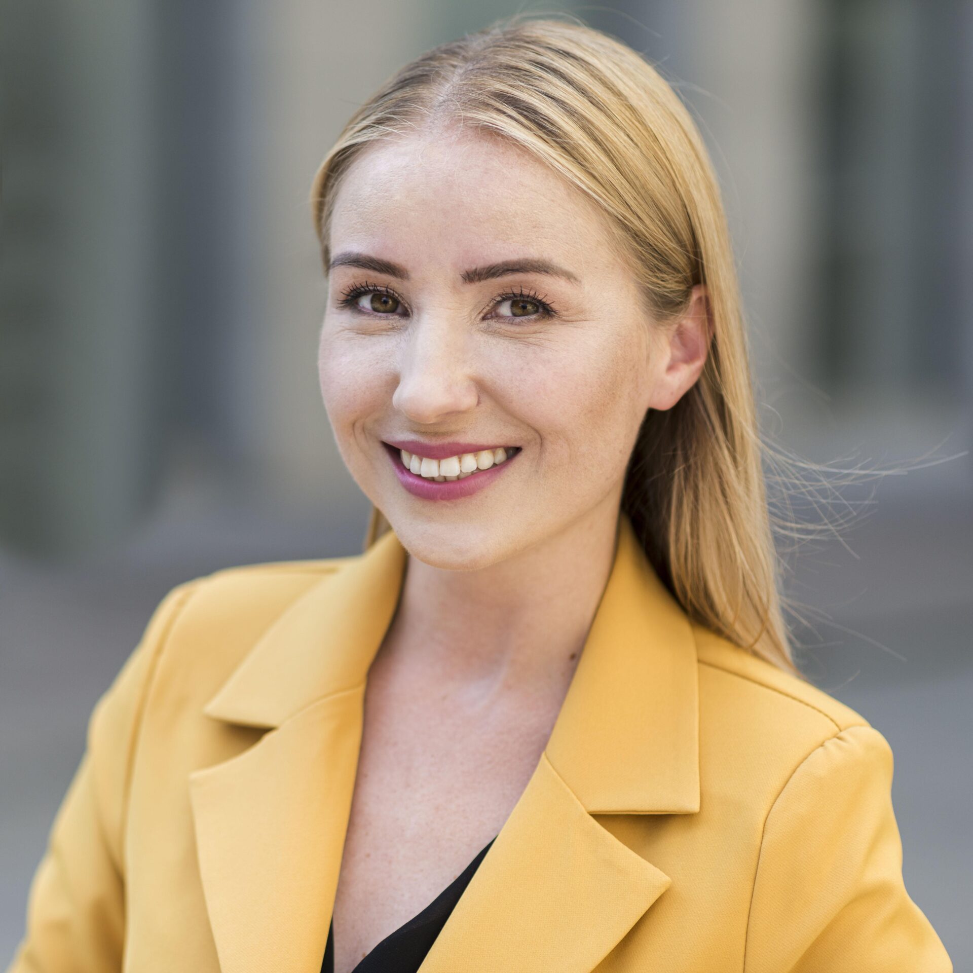 Front view of a businesswoman in a suit, symbolizing professional leadership and dedication in Melbourne Cheap's waste management services.